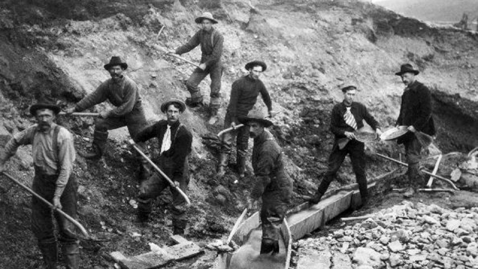 Miners at work with picks and shovels during the 19th century gold rush in Klondike, Alaska. 