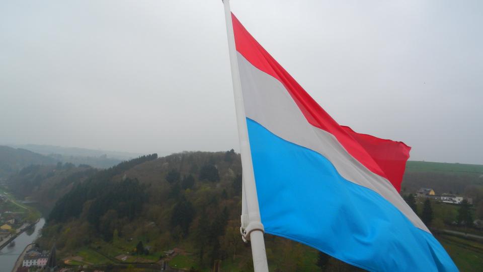 Luxembourg flag at Vianden castle. Photo by Bogdan Tapu via Flickr CC-BY-2.0.