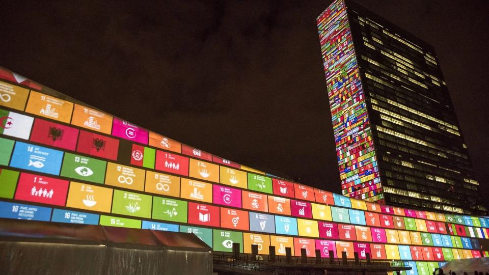 The UN headquarters in New York lit up with the Sustainable Development Goals. Photo: UN.