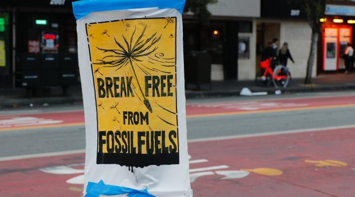 Protest sign 'break free from fossil fuels'. Photo via Unsplash.